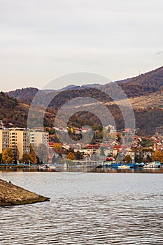 View of Danube river and Orsova city vegetation and buildings, waterfront view. Orsova, Romania, 2021