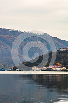 View of Danube river and Orsova city vegetation and buildings, waterfront view. Orsova, Romania, 2021