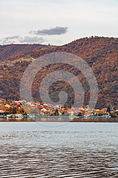 View of Danube river and Orsova city vegetation and buildings, waterfront view. Orsova, Romania, 2021