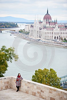 View Danube River, Parliament Building in Budapest and turist girl