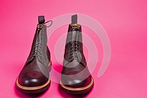 View of Dark Brown Grain Brogue Derby Boots Made of Calf Leather with Rubber Sole Placed Together