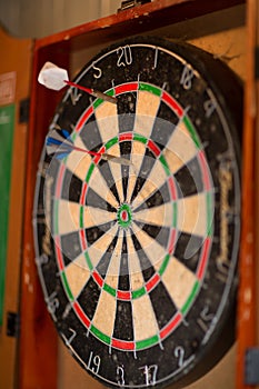 View of a dartboard with darts
