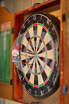 View of a dartboard with darts