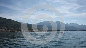 View from the deck of the yacht to the passing boat.