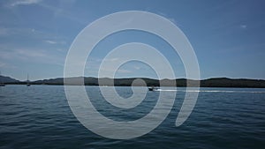 View from the deck of the yacht to the passing boat.