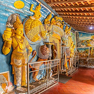 View at the decoration in sacred Buddhist temple of Aluvihare Rock Temple near Matale in Sri Lanka