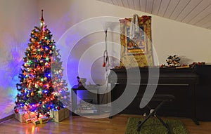 A view of a decorative Christmas tree and a piano