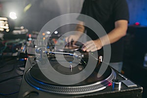 View of a deejay using vinyl turntables during a musi set