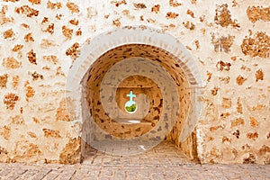View of defensive embrasures in the walls of Niebla castle, in Huelva, Andalucia, Spain