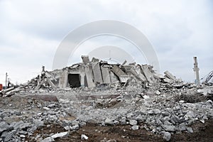 View of the demolition of a multi-storey building. Dismantling and demolition of buildings and structures. Destroy concrete