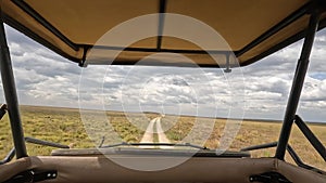 View of the desert fields of Africa from a safari jeep. Panorama of the vast expanses of Tanzania. The beautiful nature of Africa.