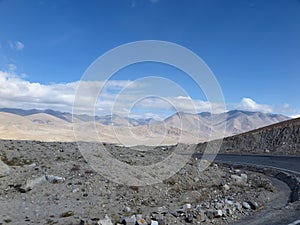 View of desert-like plateau landscape along the Karakoram Highway near Tashkurgan, Xinjiang Autonomous Region, China