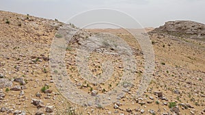 A view of a desert in the Middle East. Stone and Sand Desert Landscape. 4K video.