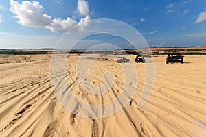 View of desert with offroad car and blue sky