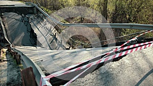 View of the destroyed road bridge as consequences a natural disaster. Bridge.
