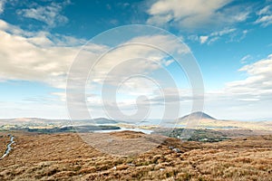 View from Diamond hill in Connemara National park, county Galway, Ireland, Bright sunny day, blue cloudy sky