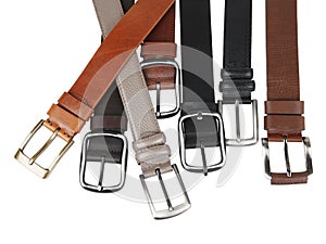 View of different leather belts with buckles isolated on white