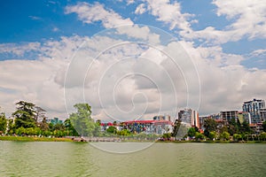 View of different modern apartment buildings on the lake shore and mountains