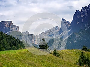 View of the Dolomite mountains from Selva Val di Gardena in Alto Adige. Dolomites behind. No people. photo