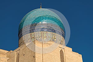 View of the dome and tower of Poi Kalon Mosque in Bukhara, Uzbekistan