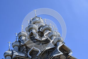 Domes and crosses of medieval wooden Church of the Transfiguration of the Lord built in 1714 on Kizhi Island on Onega Lake