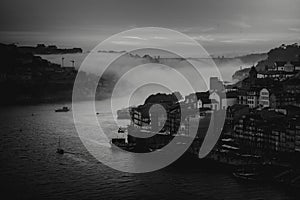 View of the Douro River in downtown in the fog during dusk, Porto, Portugal.