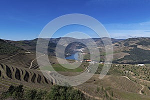 View of Douro Valley with the Pinhao village, terraced vineyards and the Douro River, in Portugal