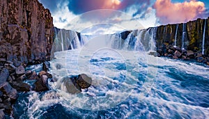 View from the down of canyon of Selfoss Waterfall. Fantastic evening scene of Jokulsa a Fjollum river, Jokulsargljufur National Pa