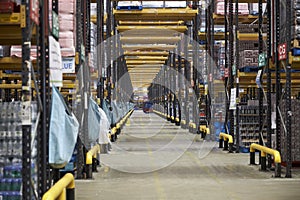 View down a central aisle in a large distribution warehouse