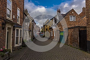 A view down a cobbled street in Melton Mowbray, Leicestershire, UK