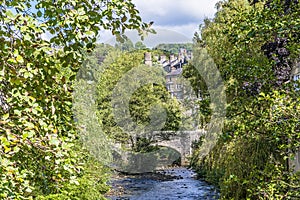 A view down Hebden Beck towards the original bridge in Hebden Bridge, Yorkshire, UK