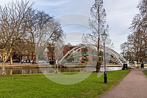 A view down the island on River Great Ouse towards the Suspension Bridge in Bedford, UK