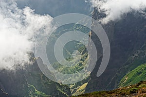 View down from mountain peak at a valley in the distant