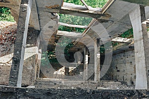 View down in the old destroyed factory building, floors without overlap