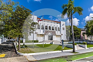 A view down past buildings beside Constitutional Avenue in San Juan, Puerto Rico