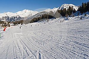 View down a piste in alpine ski resort