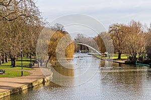 A view down the River Great Ouse towards the Butterfly pedestrian bridge in Bedford, UK