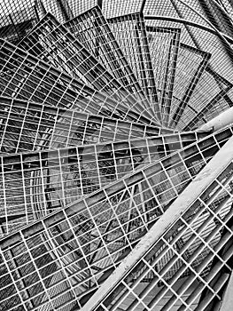 View down throught the circular metal staircase, black and white