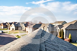 View down the top of an Asphalt shingle roof with ridge cap