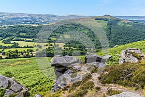 A view down towards the Hope Valley past the rocky outcrops of Bamford Edge, UK