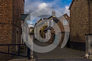 A view down a traditional quaint street in Melton Mowbray, Leicestershire, UK