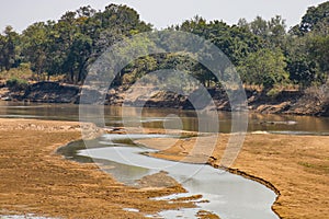 View downstream of the luangwa river near the national park in zambia photo