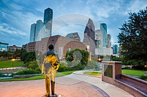 View of downtown Houston at twilight with skyscraper