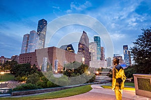 View of downtown Houston at twilight with skyscraper