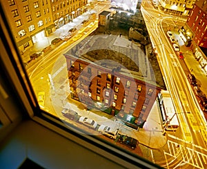 A view of downtown NYC street and building from a window