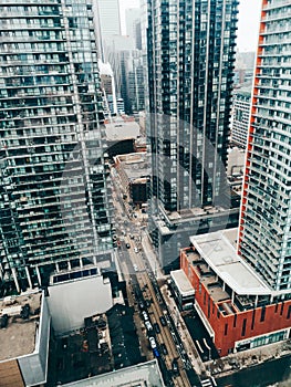 View on downtown Toronto city in Canada, Ontario from top above roof. Aerial urban view from high. Busy urban city street. Urban