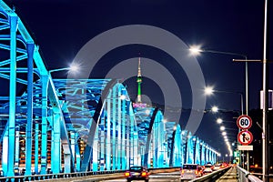 View of downtown traffic at Dongjak Bridge and Seoul tower over Han river in Seoul, Korea.