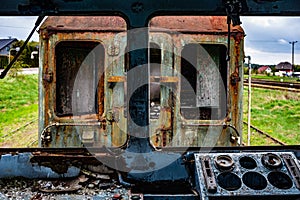 View from the driver\'s cabin of an old damaged passenger electric train