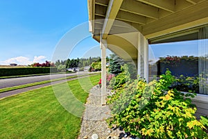 View of driveway near luxury American house exterior.