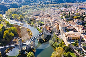 View from drone of Besalu with arched bridge over Fluvia river